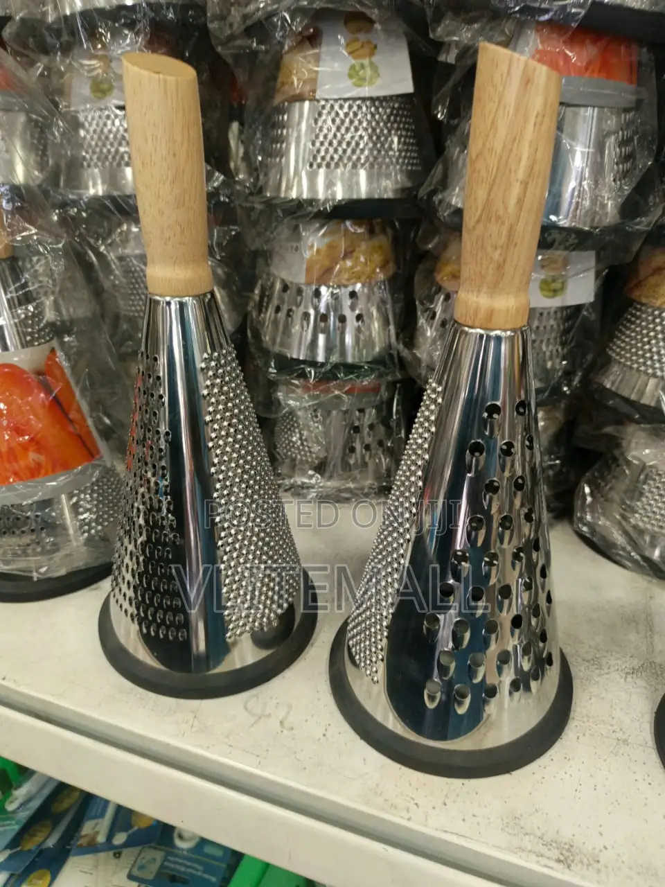 Stainless Steel Cone Graters With Wooden Handles.