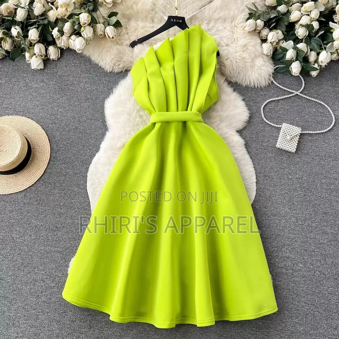 Make A Bold Entrance In Our Stunning Lime Green One Shoulder Dress.