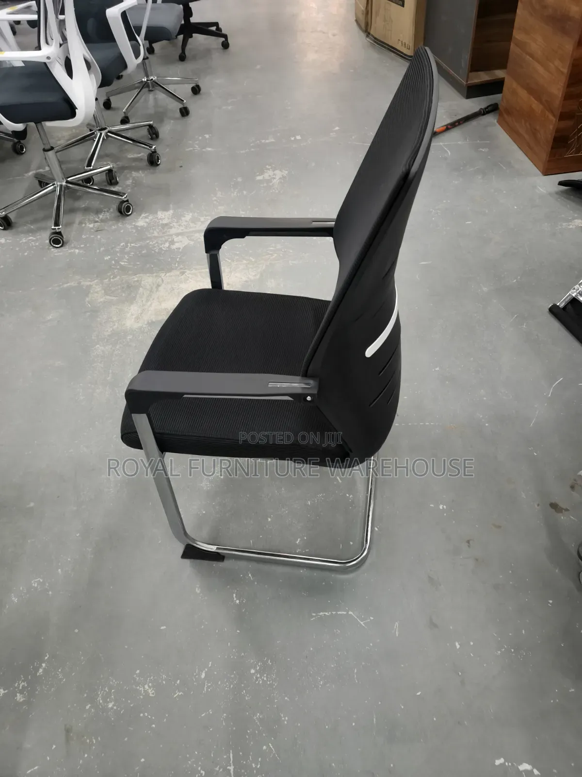 Black Cantilever Visitor's Or Conference Chair With A Chrome Frame.