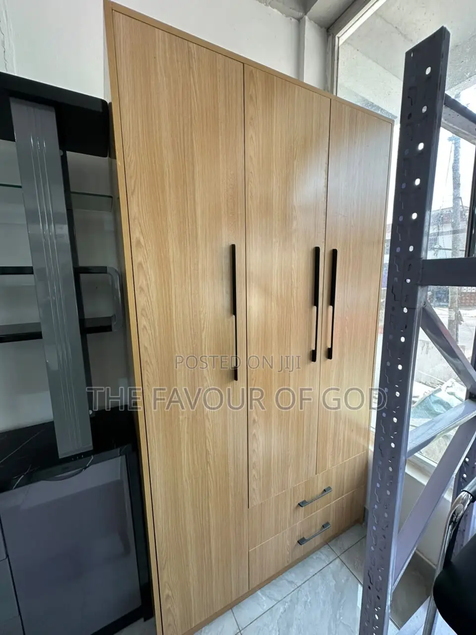 A Weighty 3 Door Mirrorless Wardrobe