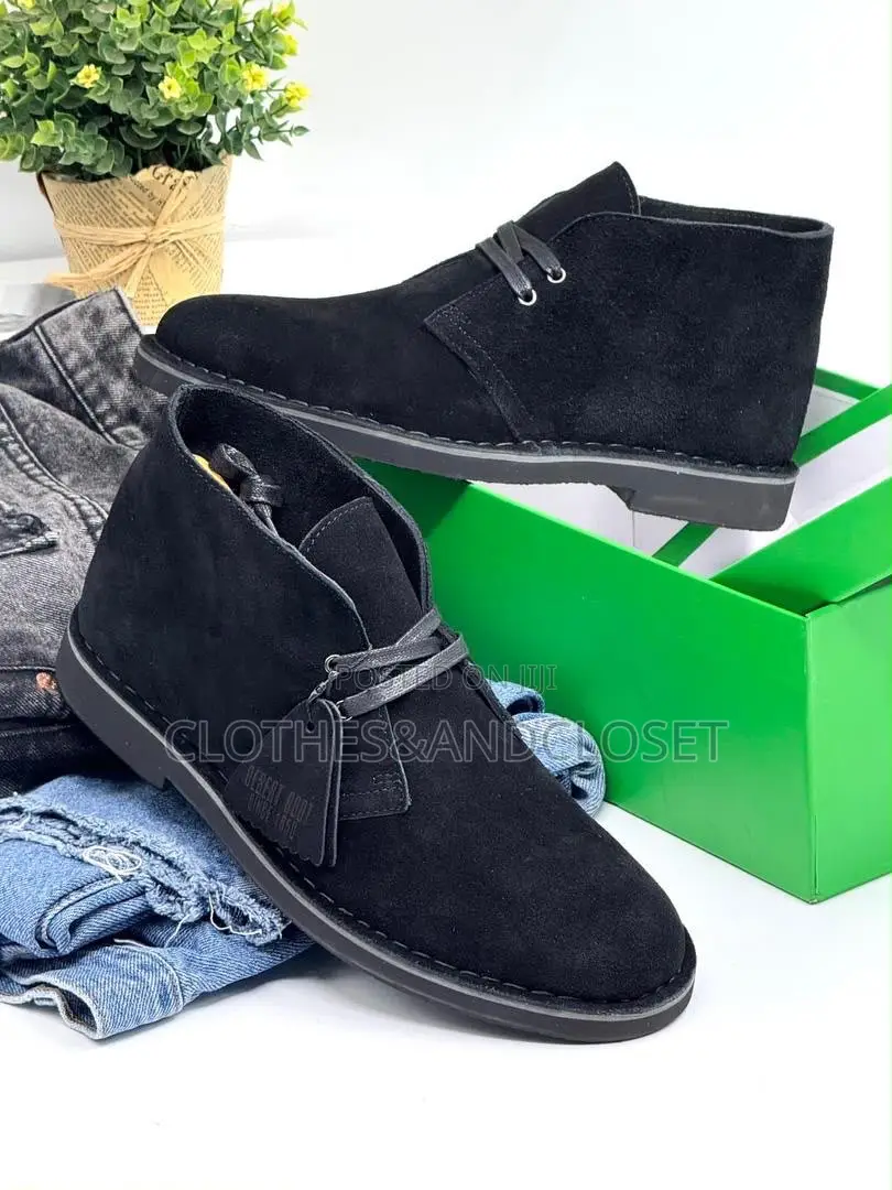 Clarks Desert Boots Feature a Black Suede Upper With Two-Eyelet Lacing