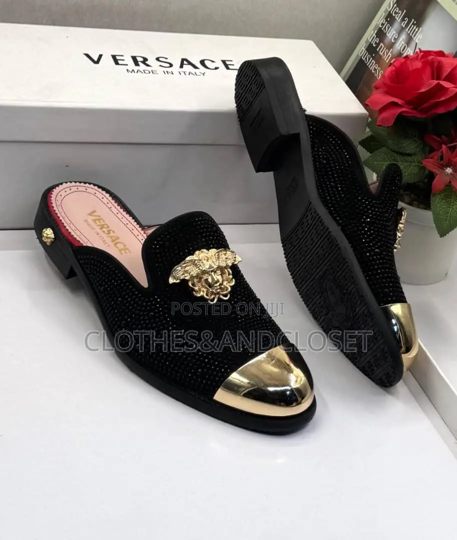 Versace Shoes Feature a Gold Toe Cap and a Medusa Emblem.
