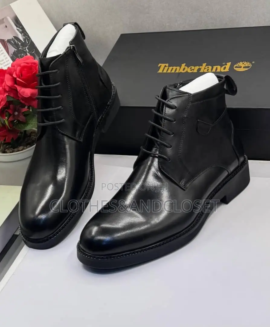 Sleek Black Leather Formal Ankle Boot Feature a Classic Lace-Up Design
