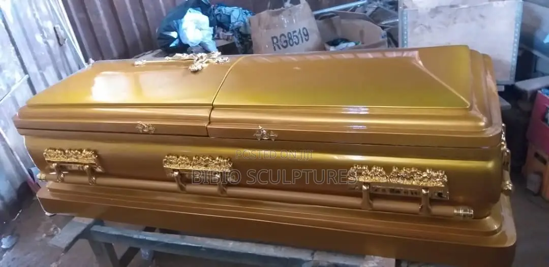 Gold Gloss Casket With Ornate Handles
