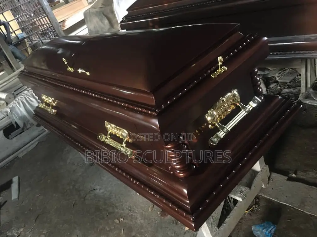 Mahogany-Finish Casket With Carved Pillars