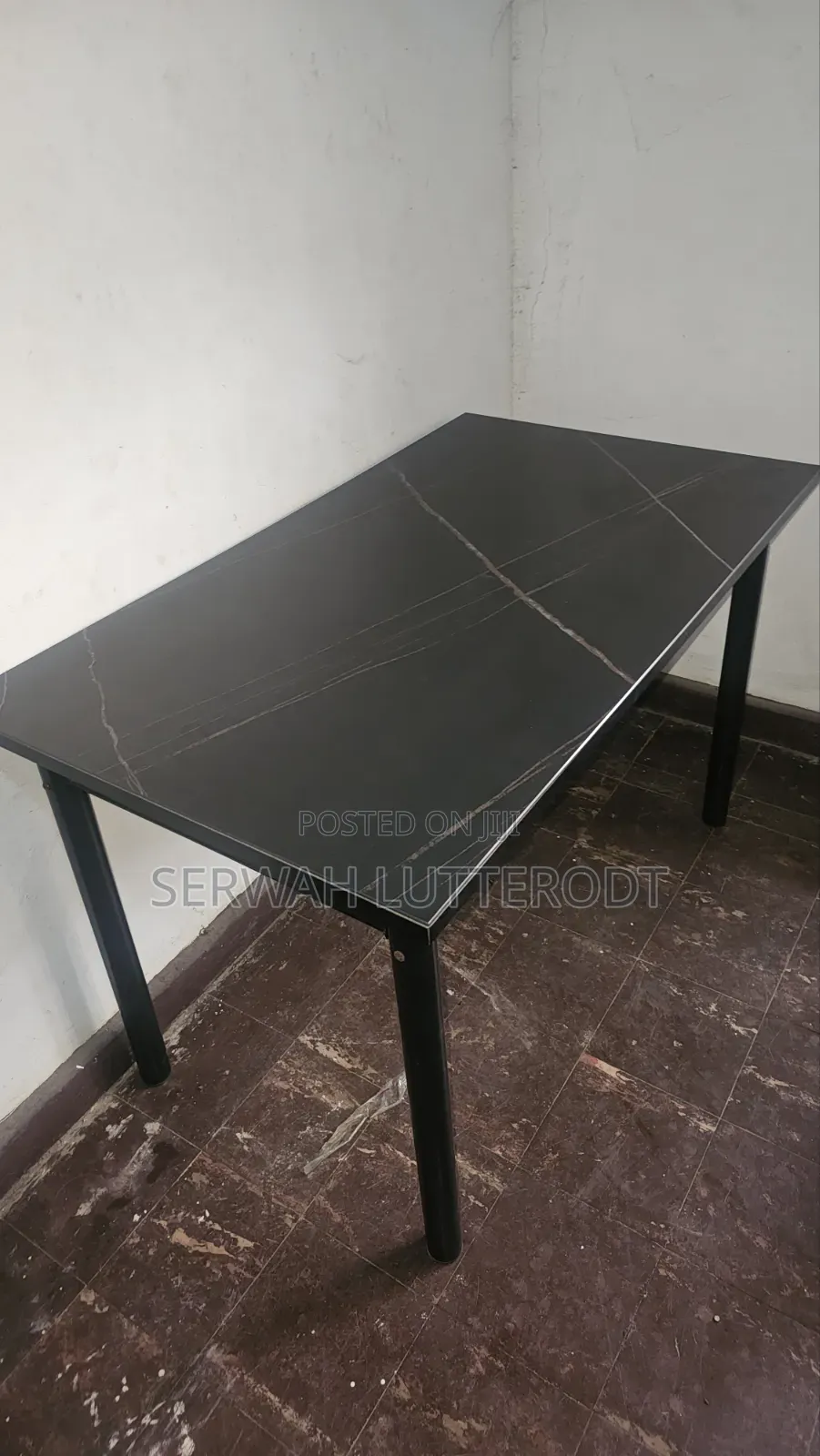 Table and 4 Chairs. (Small Chip on Side of Table)