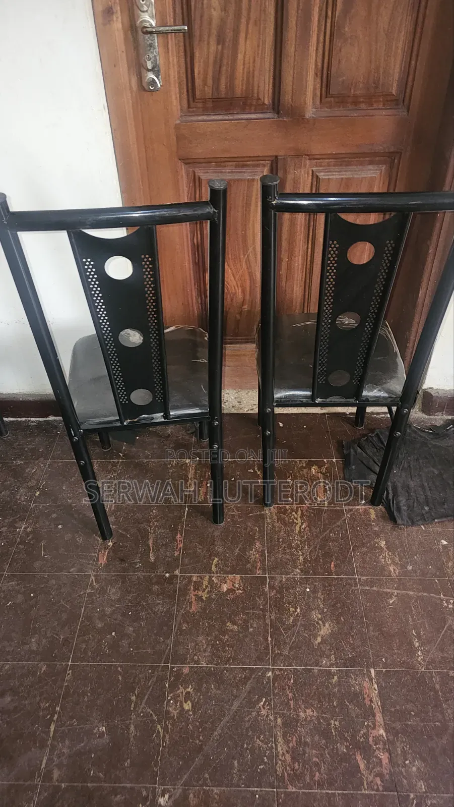 Table and 4 Chairs. (Small Chip on Side of Table)