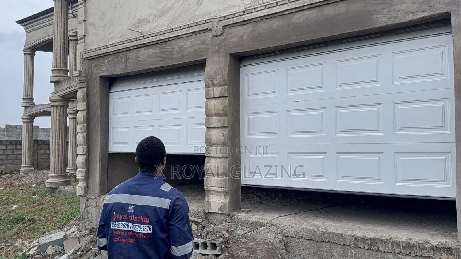 White Modern Remote Double Garage Door Well Installed