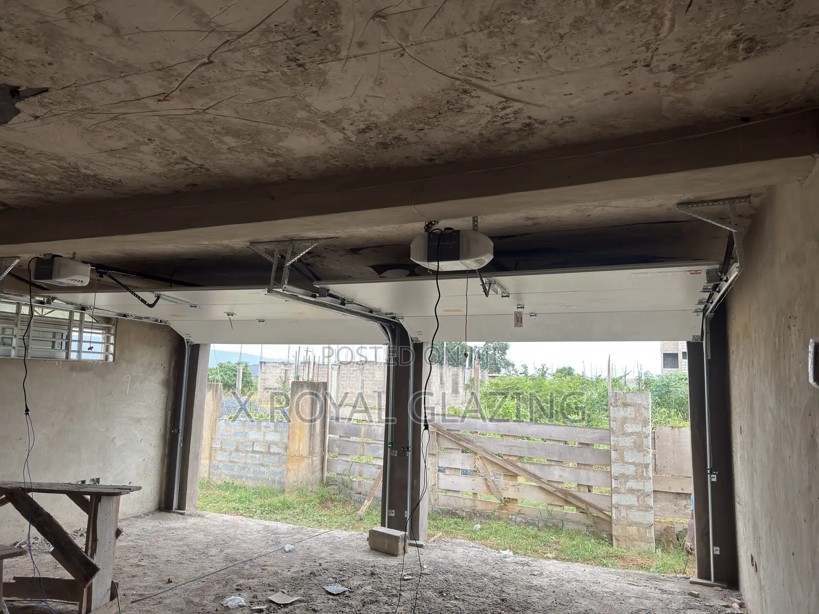 White Modern Remote Double Garage Door Well Installed