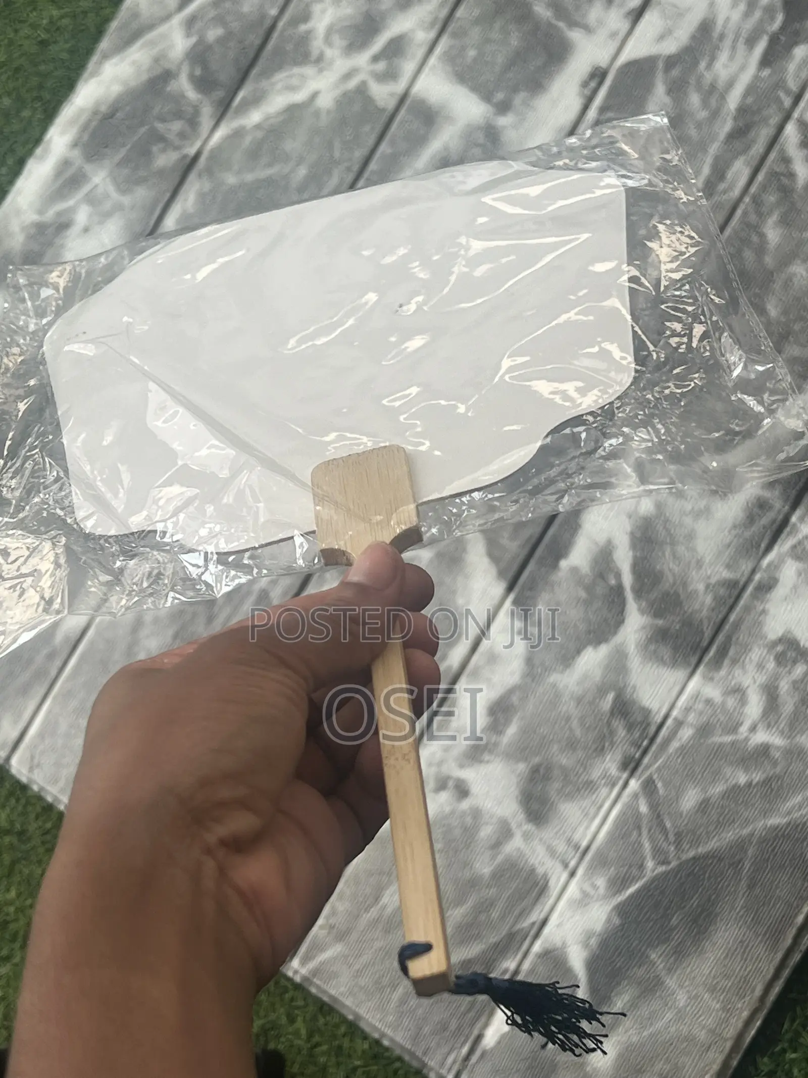 This Is a Fan With Wooden Handle