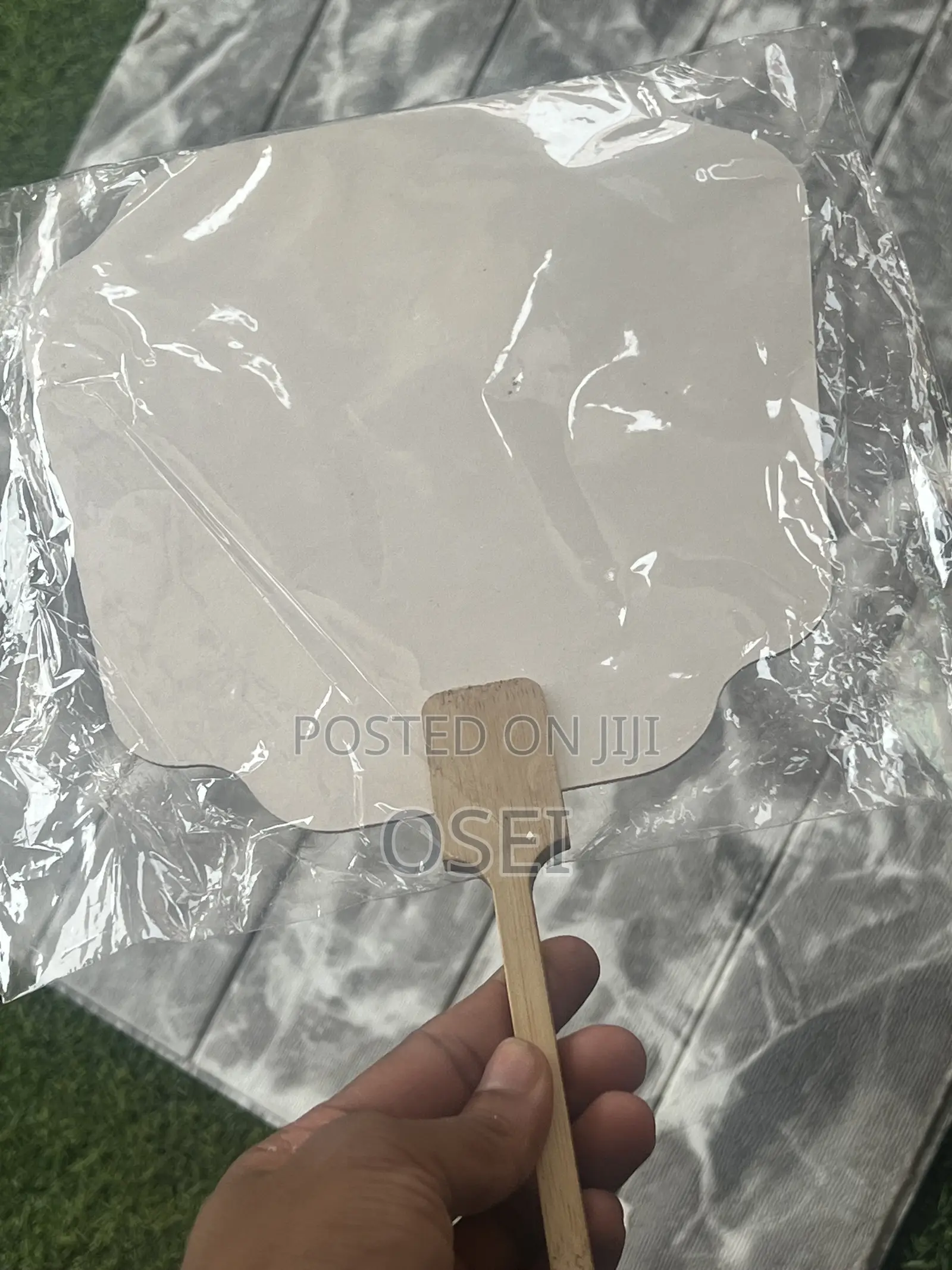 This Is a Fan With Wooden Handle