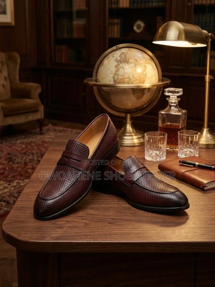 Corium "Trento" Textured Leather Penny Loafers.