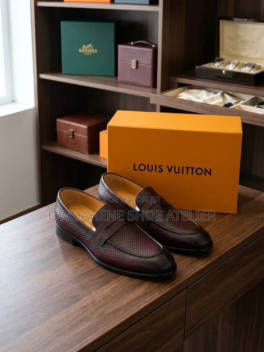 Corium "Trento" Textured Leather Penny Loafers.
