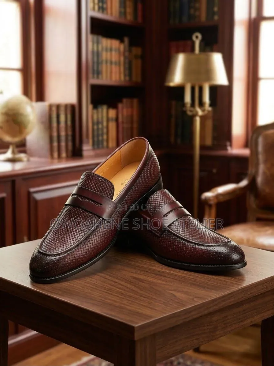 Corium "Trento" Textured Leather Penny Loafers.