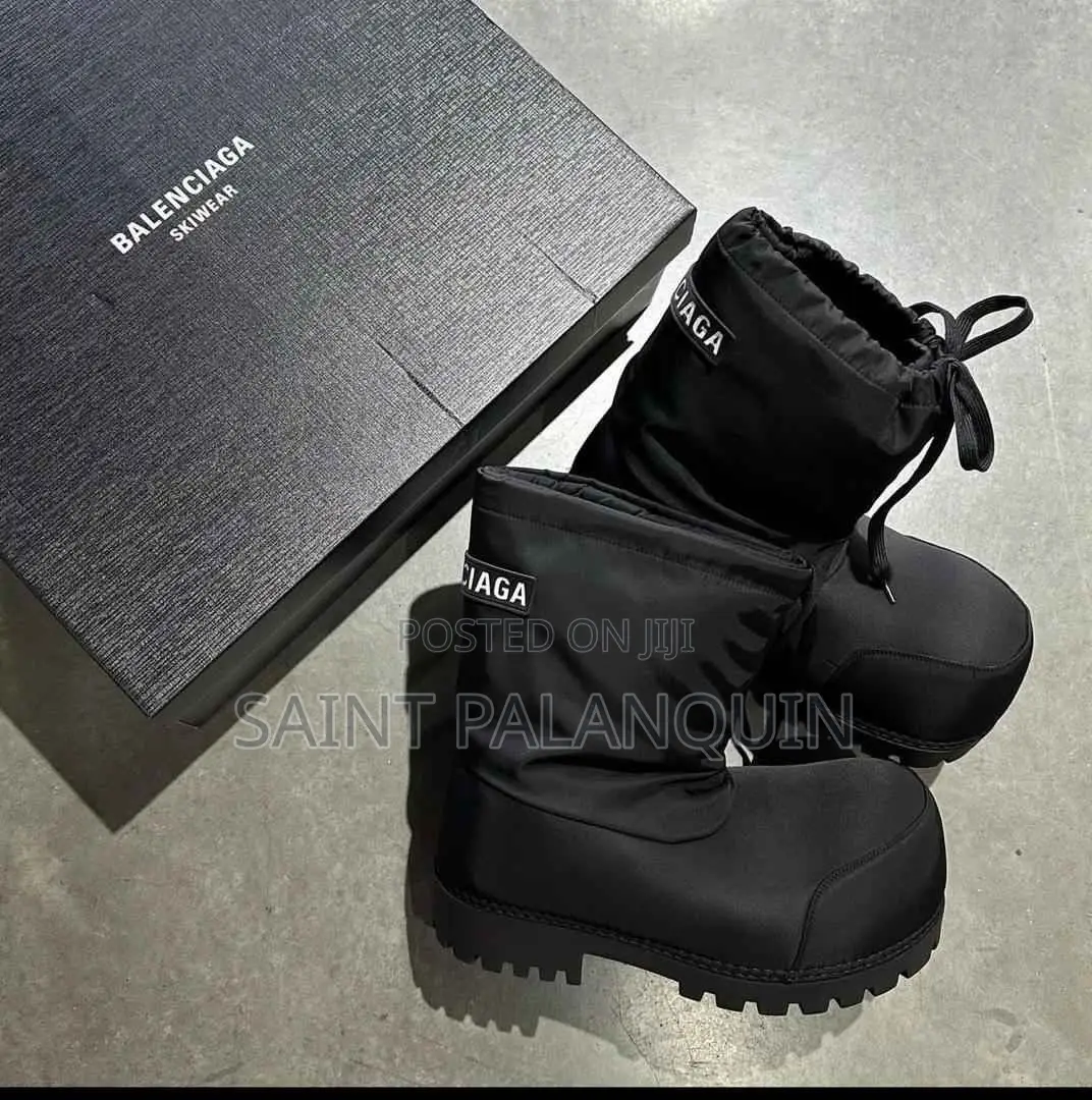 A Pair of Black Balenciaga Alaska Low Boots Featuring Exaggerated