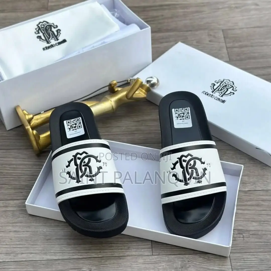 The Image Shows a Pair of Black and White Roberto Cavalli Slides