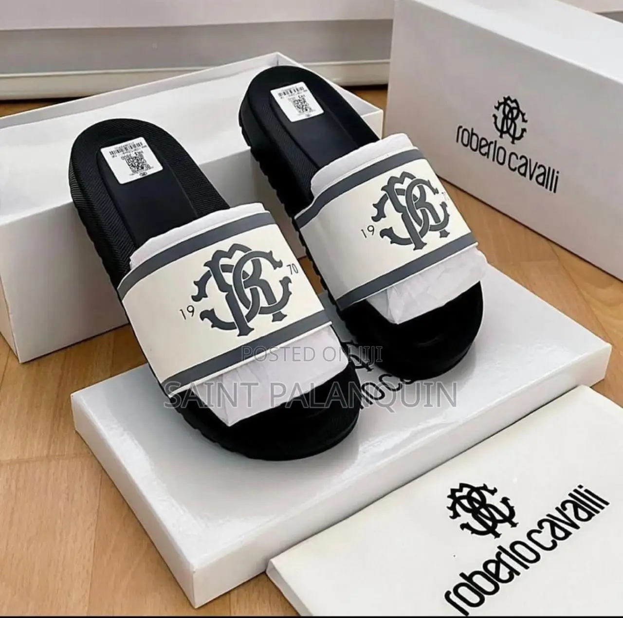 The Image Shows a Pair of Black and White Roberto Cavalli Slides