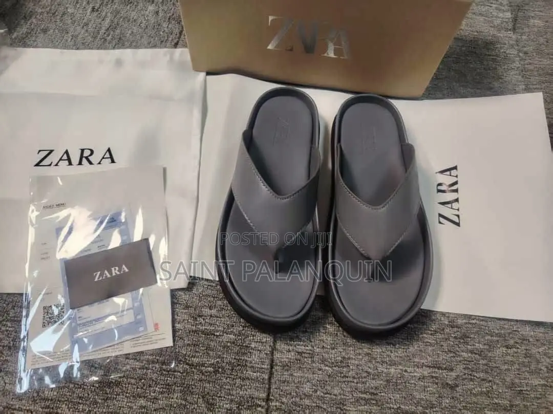 The Image Displays a Pair of Gray Platform Thong Sandals
