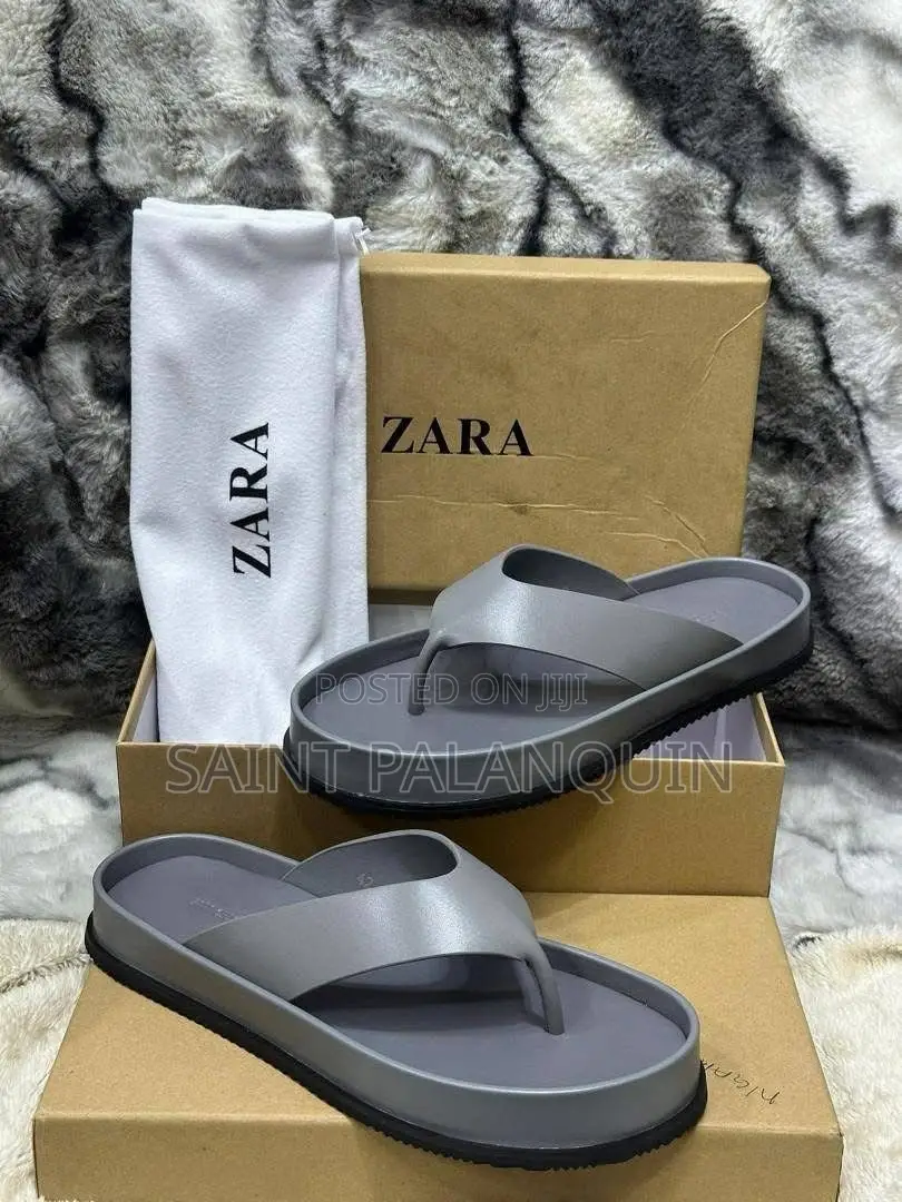 The Image Displays a Pair of Gray Platform Thong Sandals