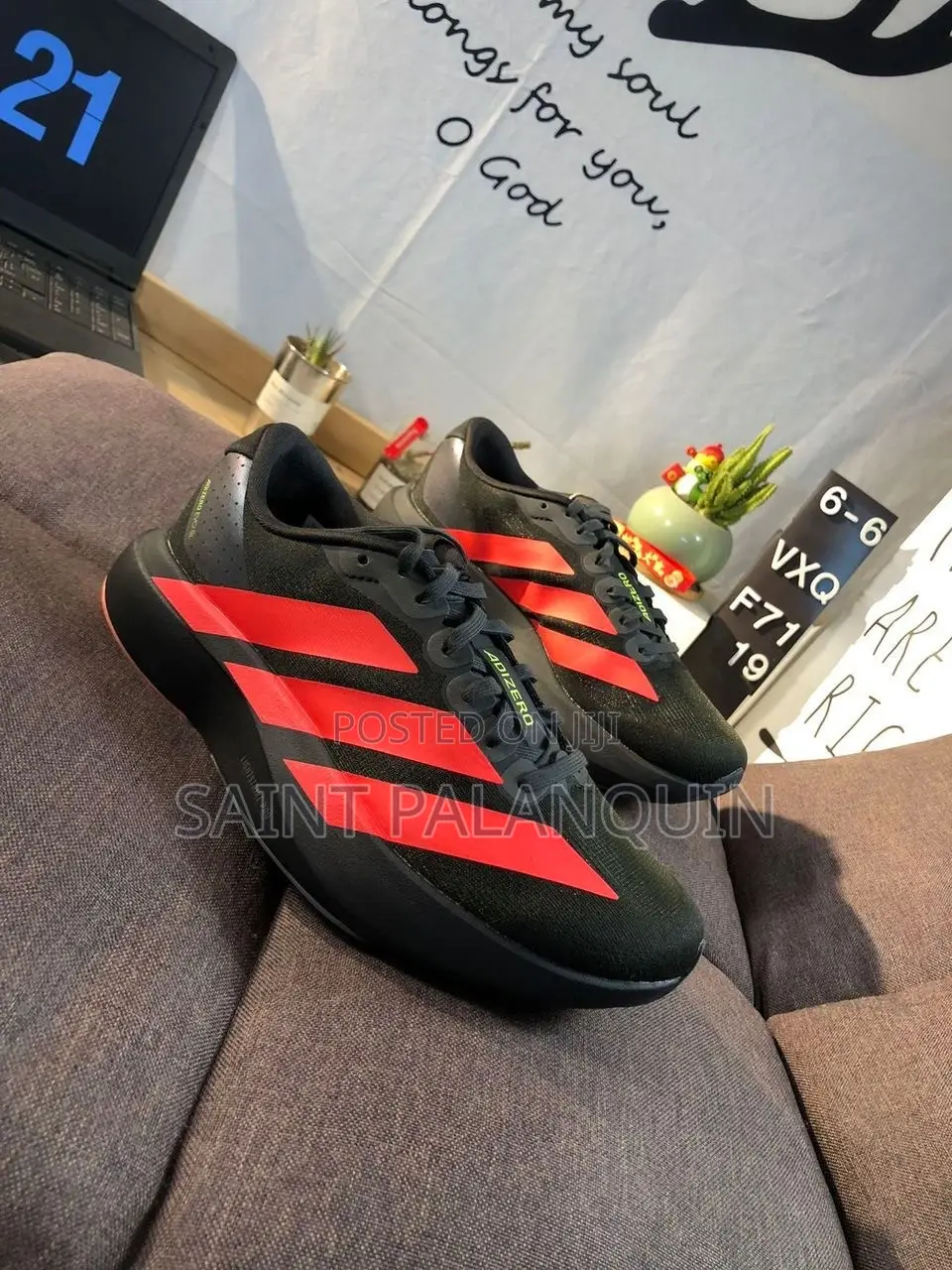 The Adidas Adizero EVO SL Running Sneakers in a Black and Lucid Red
