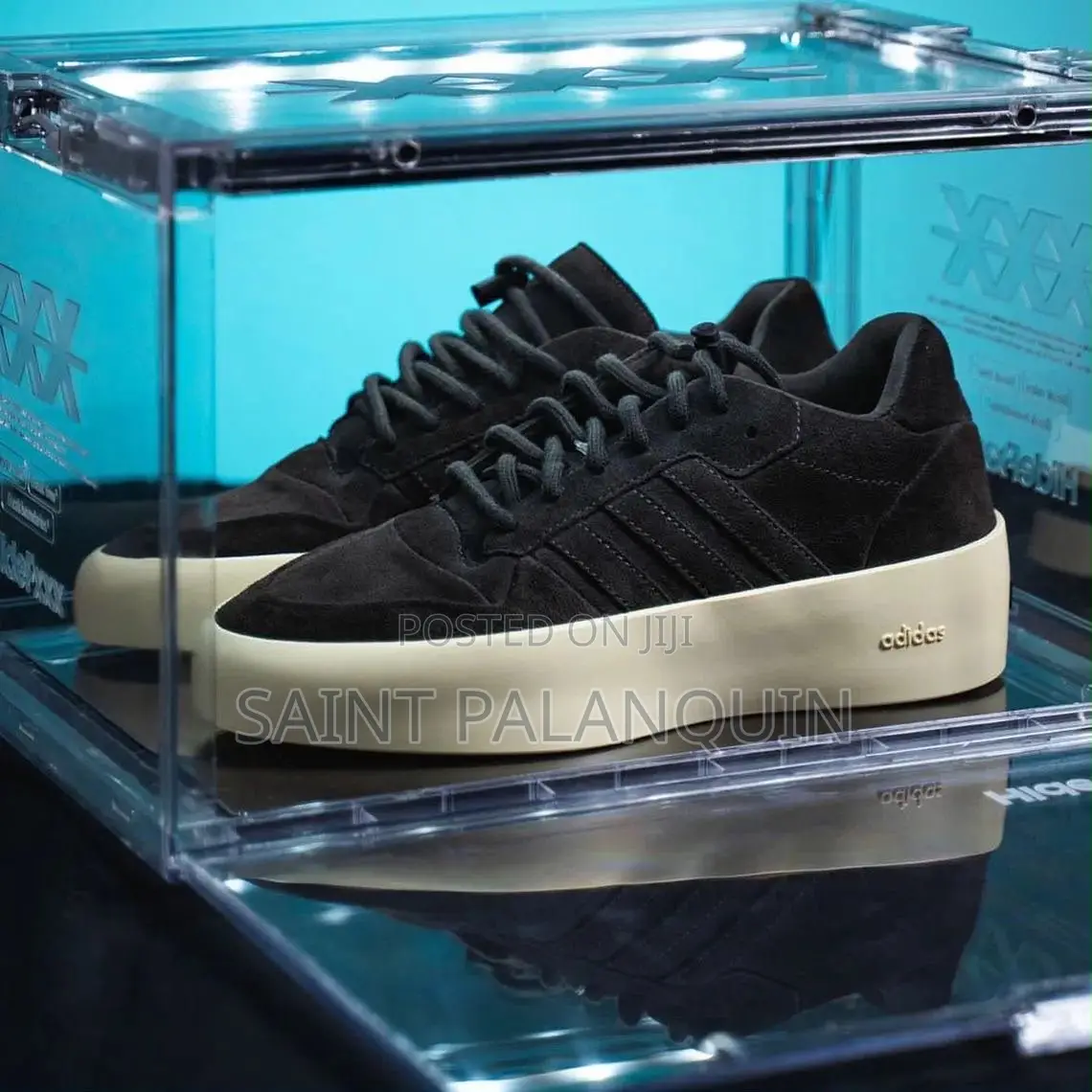 Apair of Black Adidas X Fear of God Athletics Sneakers