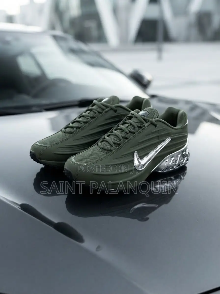 The Image Shows the Olive Green Nike NOCTA Glide Sneakers