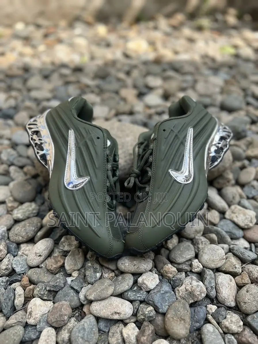 The Image Shows the Olive Green Nike NOCTA Glide Sneakers
