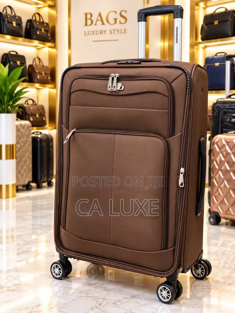 Brown Softside Fabric Suitcase With Zipper Compartments and Wheels