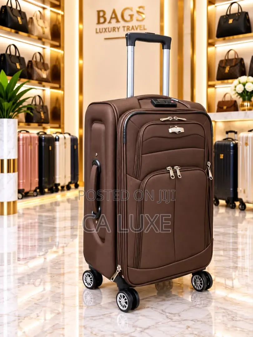 Brown Softside Fabric Suitcase With Zipper Compartments and Wheels