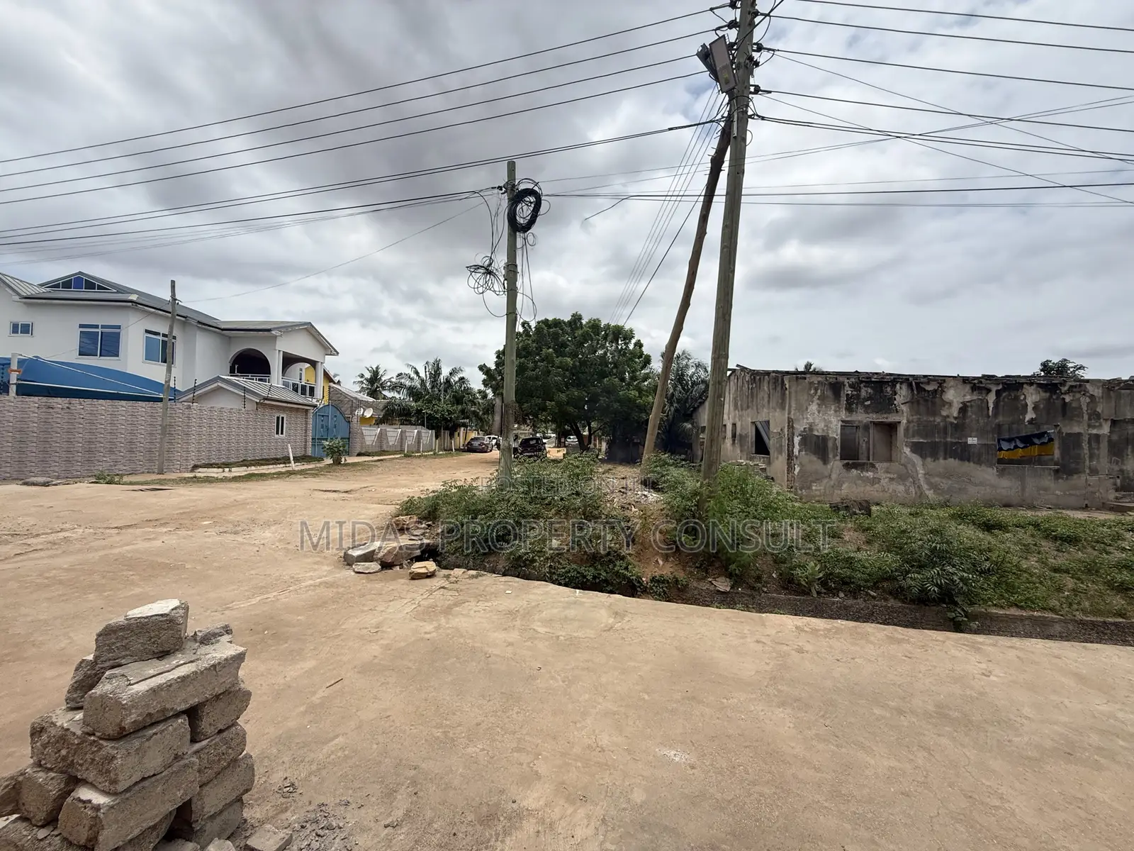 A Plot of Titled Land for Sale at Spintex With an Old Structure