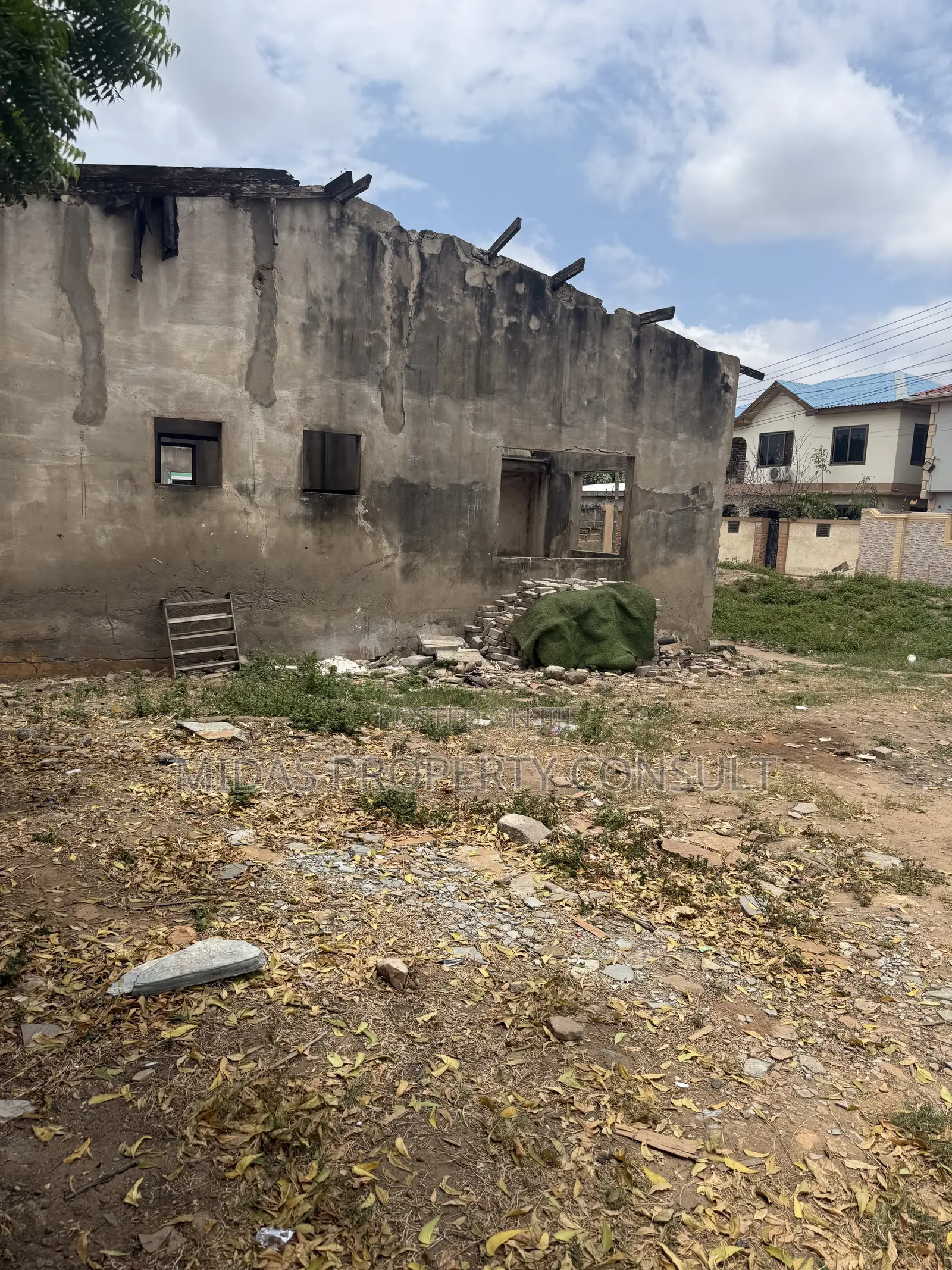 A Plot of Titled Land for Sale at Spintex With an Old Structure