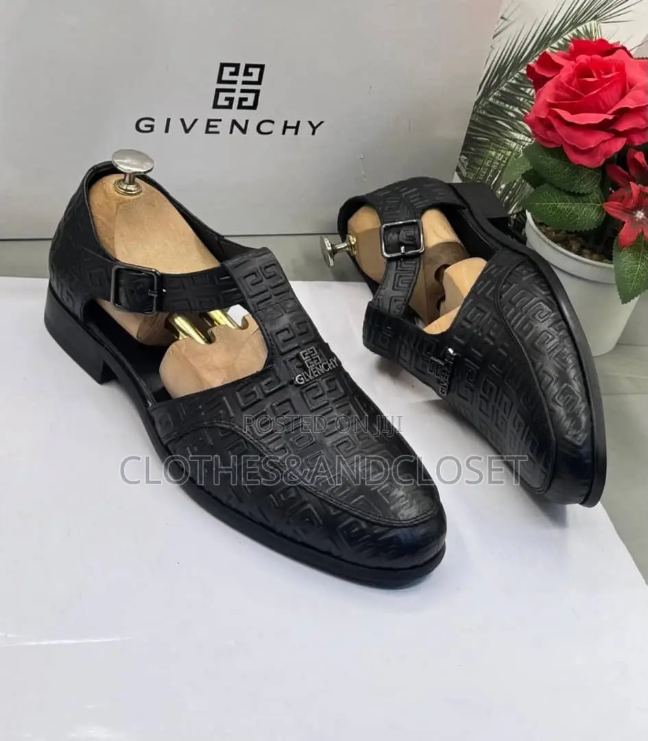 A Pair of Black Embossed Leather Monk-Strap Shoe-Sandals