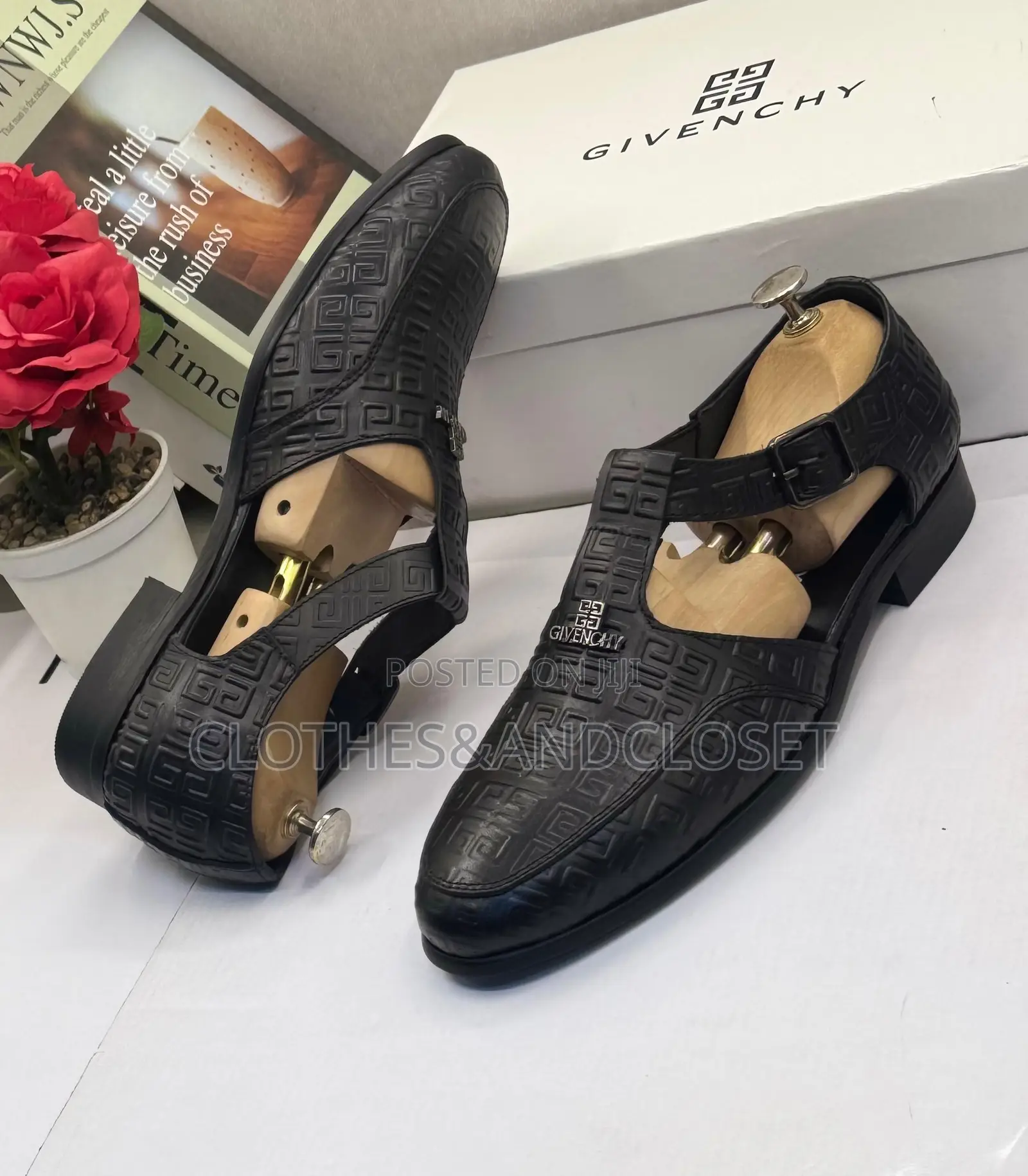 A Pair of Black Embossed Leather Monk-Strap Shoe-Sandals