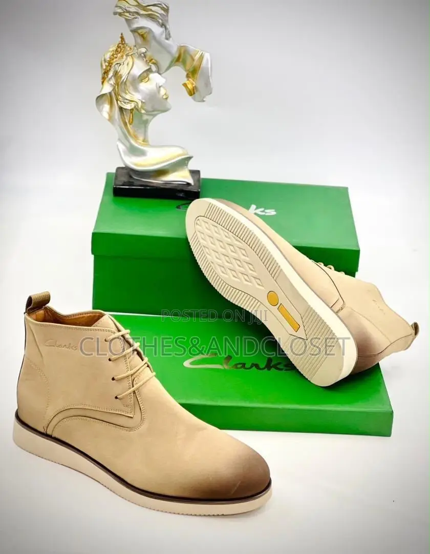 Tan Clarks Chukka Boots Feature a Stylish Burnished Gradient Toe