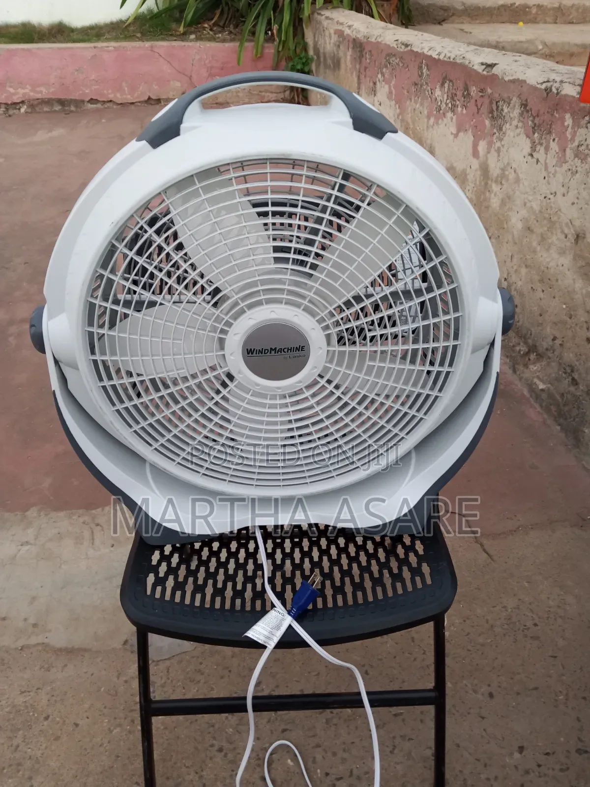 A Lasko Wind Machine 20-Inch Air Circulator Fan