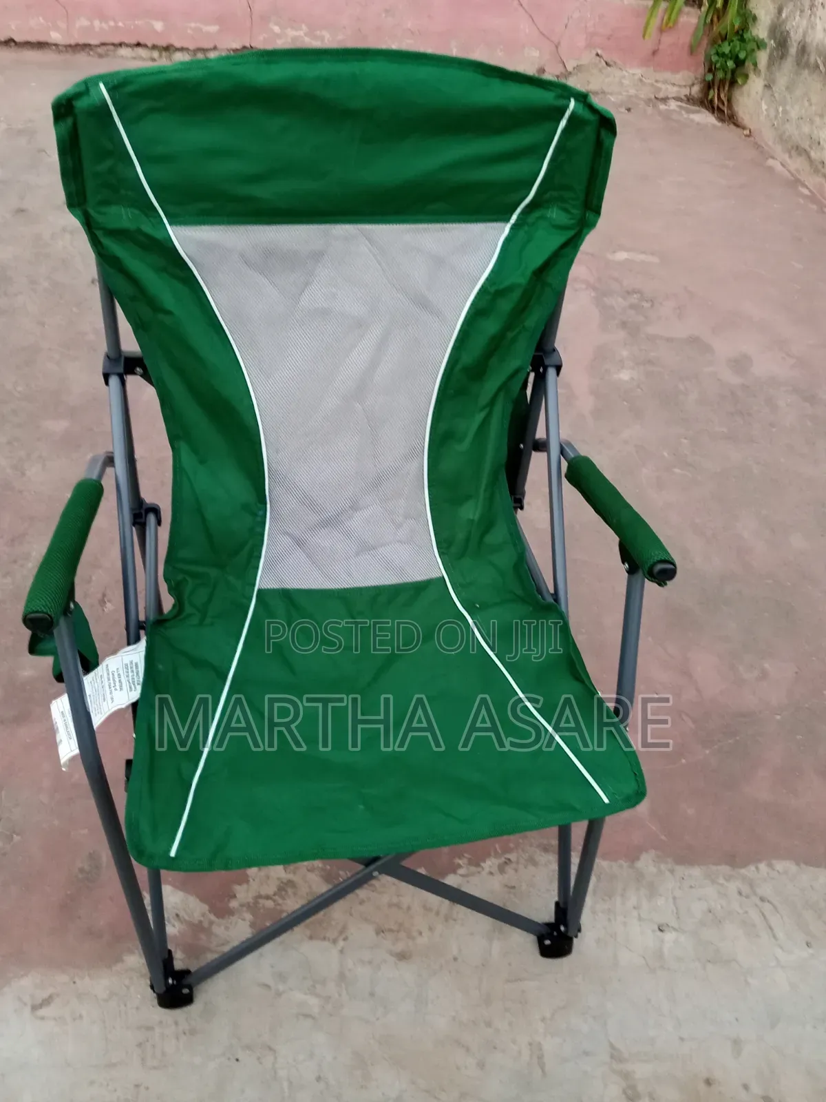 A Green Folding Portable Camping Chair With Hard Armrests,.