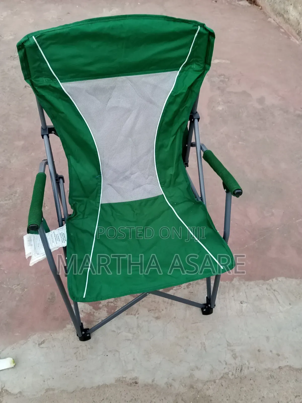 A Green Folding Portable Camping Chair With Hard Armrests,.