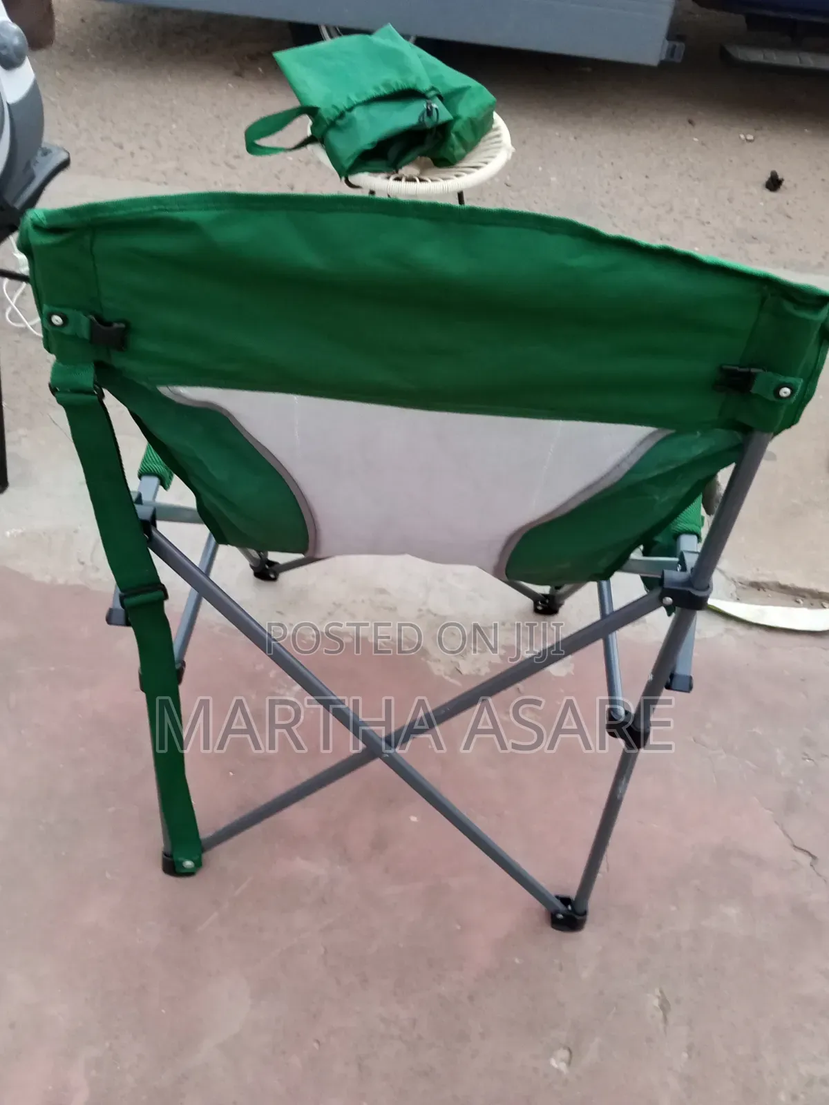 A Green Folding Portable Camping Chair With Hard Armrests,.
