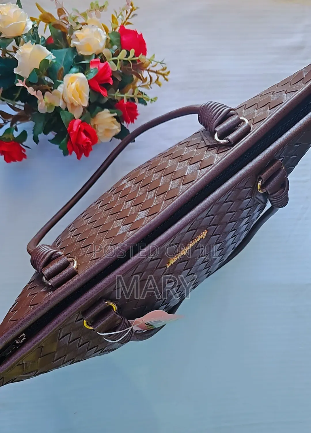 A Dark Brown Woven Leather Handbag