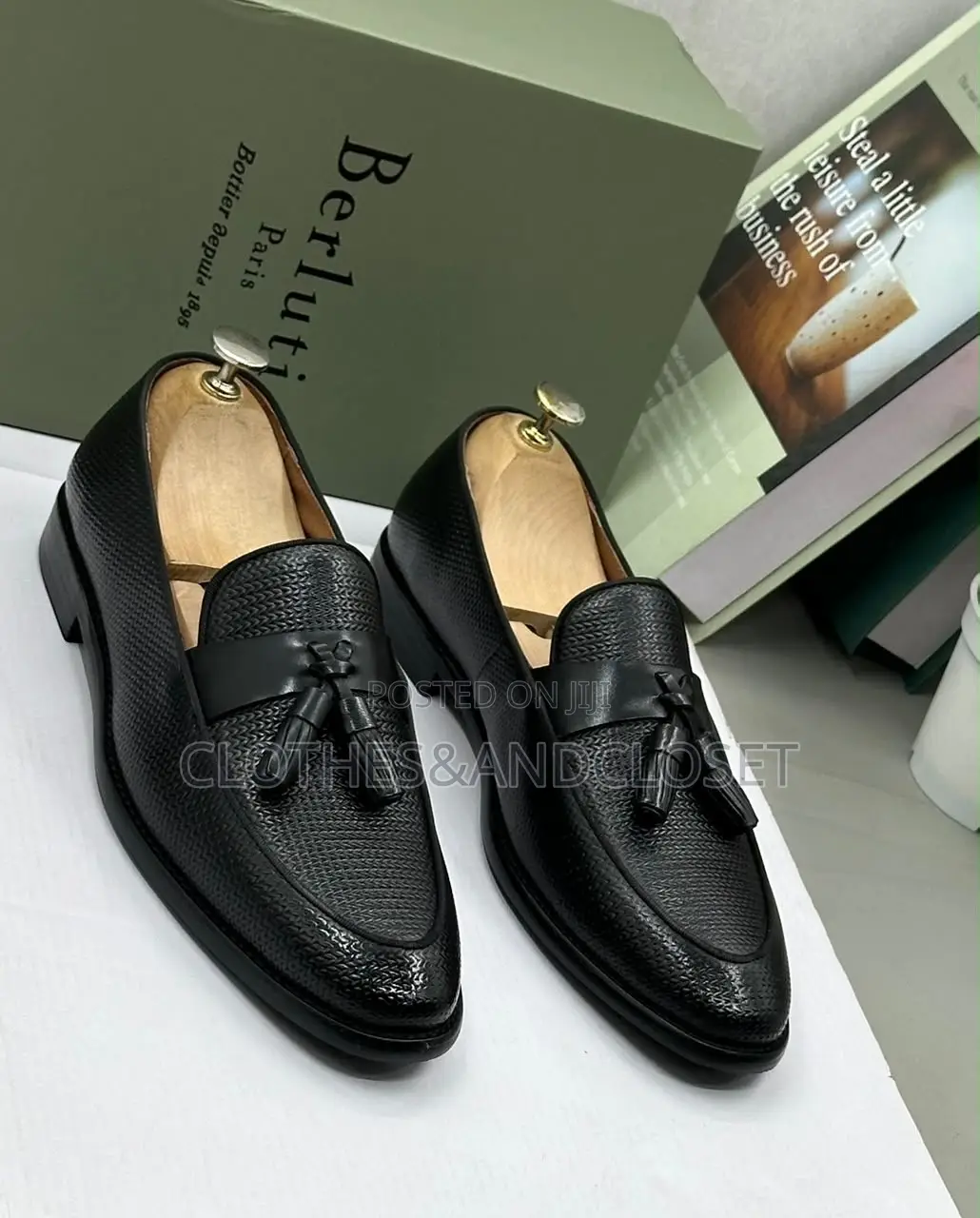 S a Pair of Black Textured Leather Tassel Loafers on Wooden Shoe Trees