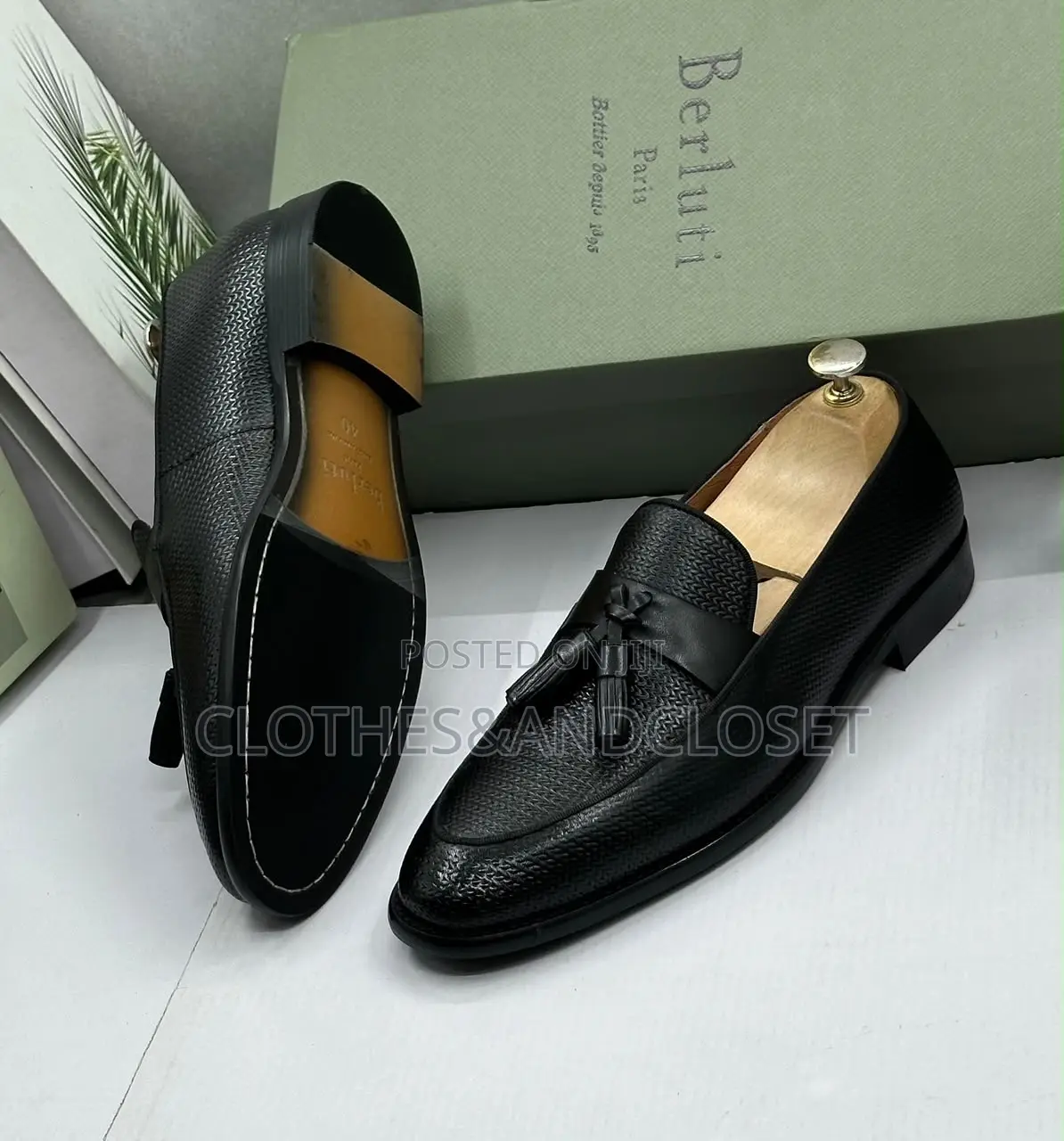 S a Pair of Black Textured Leather Tassel Loafers on Wooden Shoe Trees