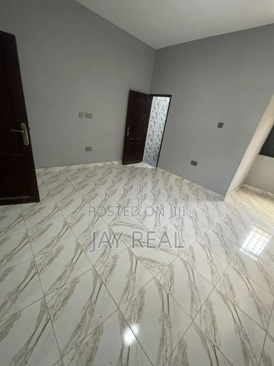 Road Side Plot With a Single Room Structure.