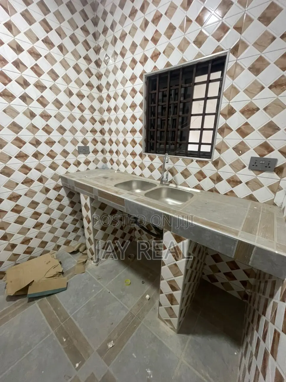 Road Side Plot With a Single Room Structure.