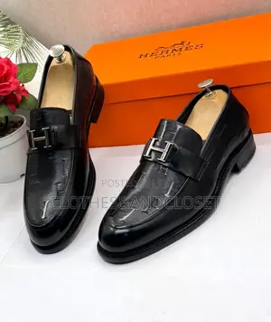 Black Leather Hermès Paris Men's Loafers Featuring a Signature Metalli