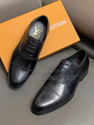 Black Leather Cap-Toe Lace-Up Oxfords Featuring Subtle Branding .
