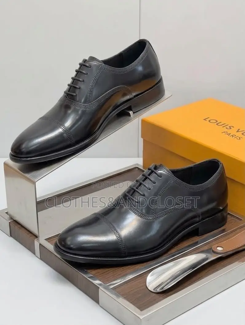 Black Leather Cap-Toe Lace-Up Oxfords Featuring Subtle Branding .
