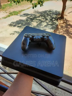 PS4 Slim With FC 27 and 7 Other Games + 2 Controllers