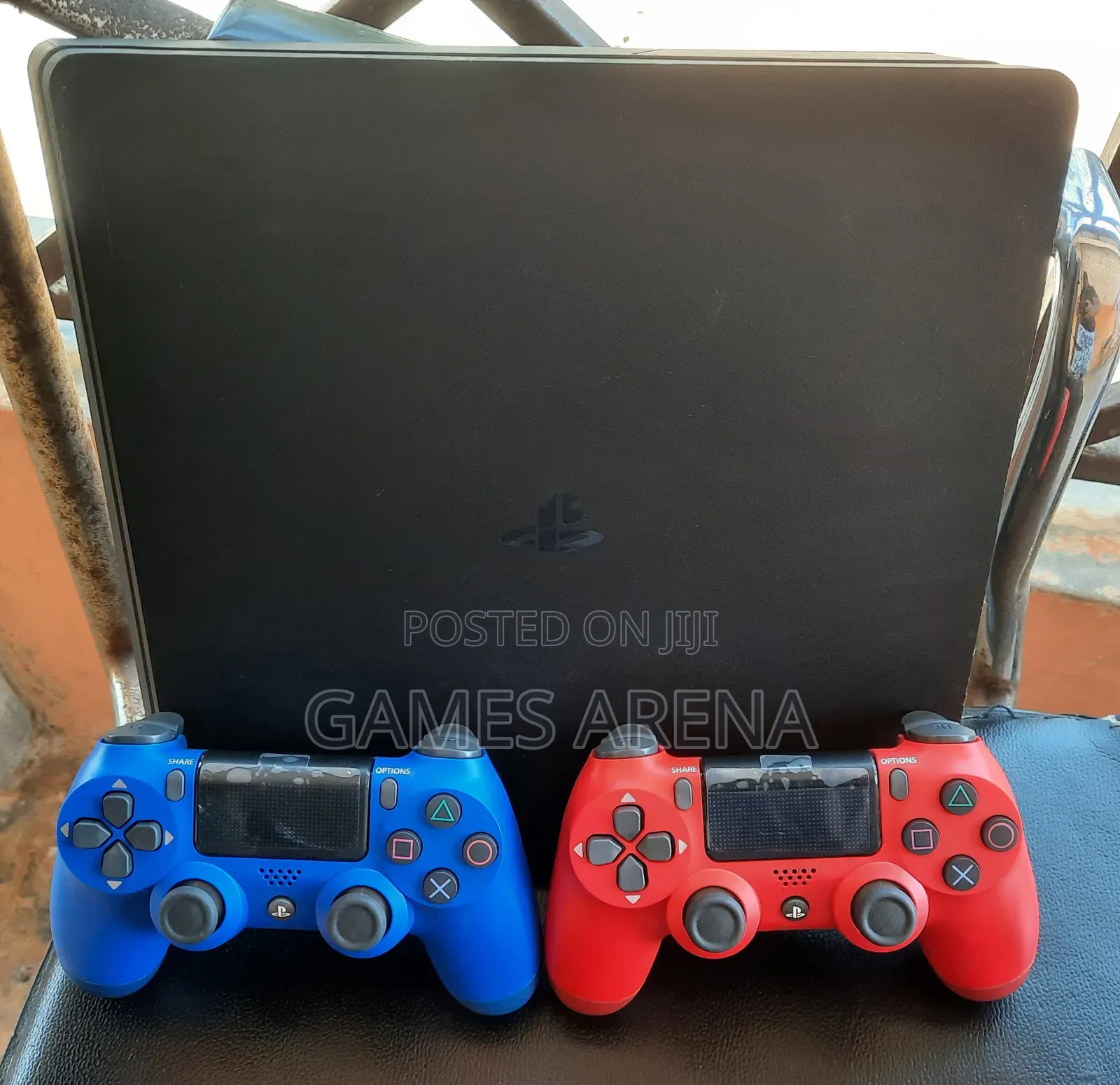 PS4 Slim With FC 27 and 7 Other Games + 2 Controllers