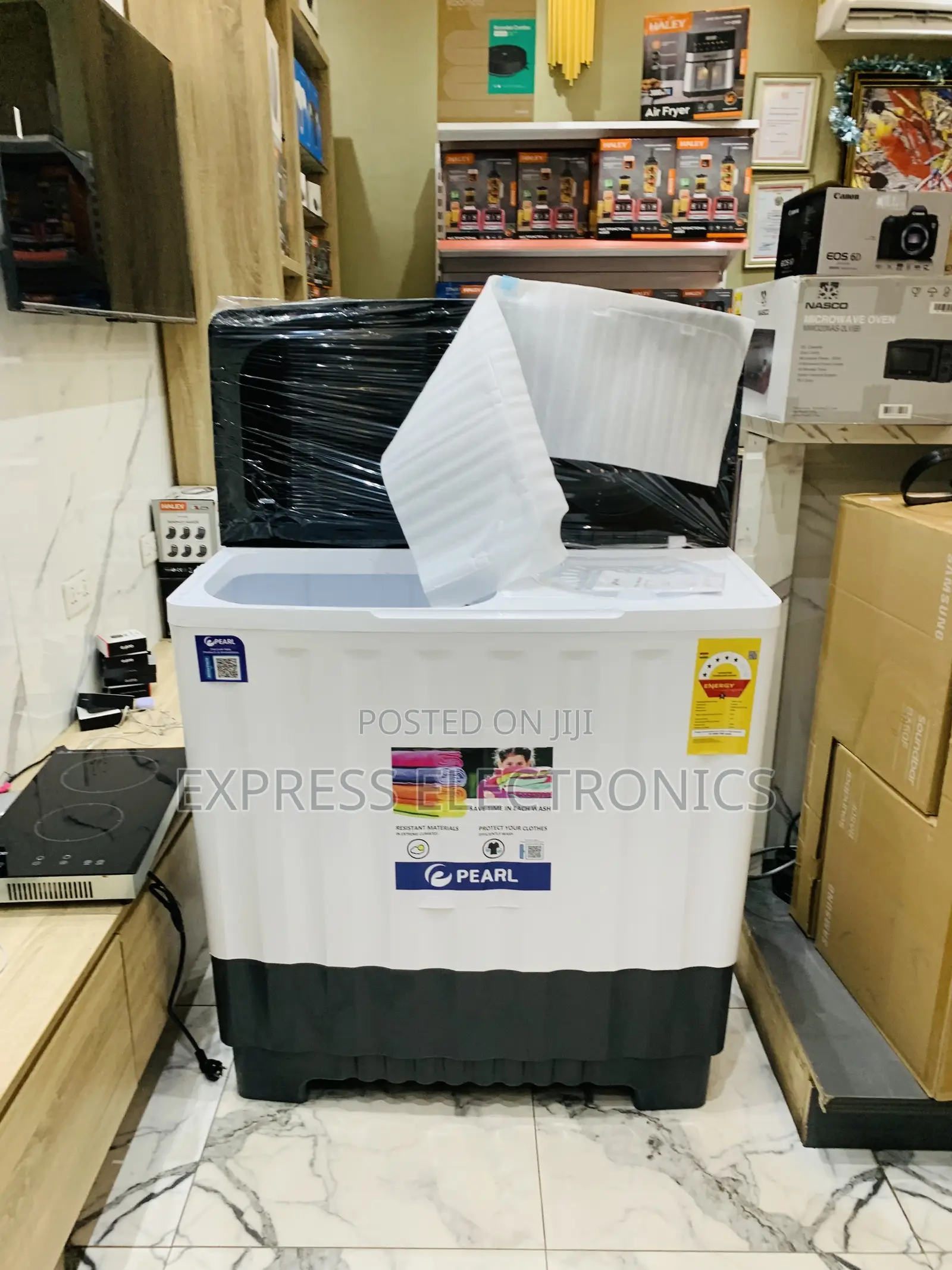 Grab the New Pearl 20kg Topload Twintu. Semi Auto Fast Wash and Spin