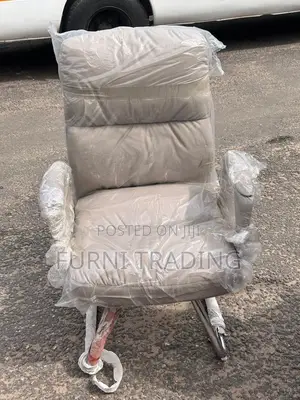 Beige High-Back Padded Chair